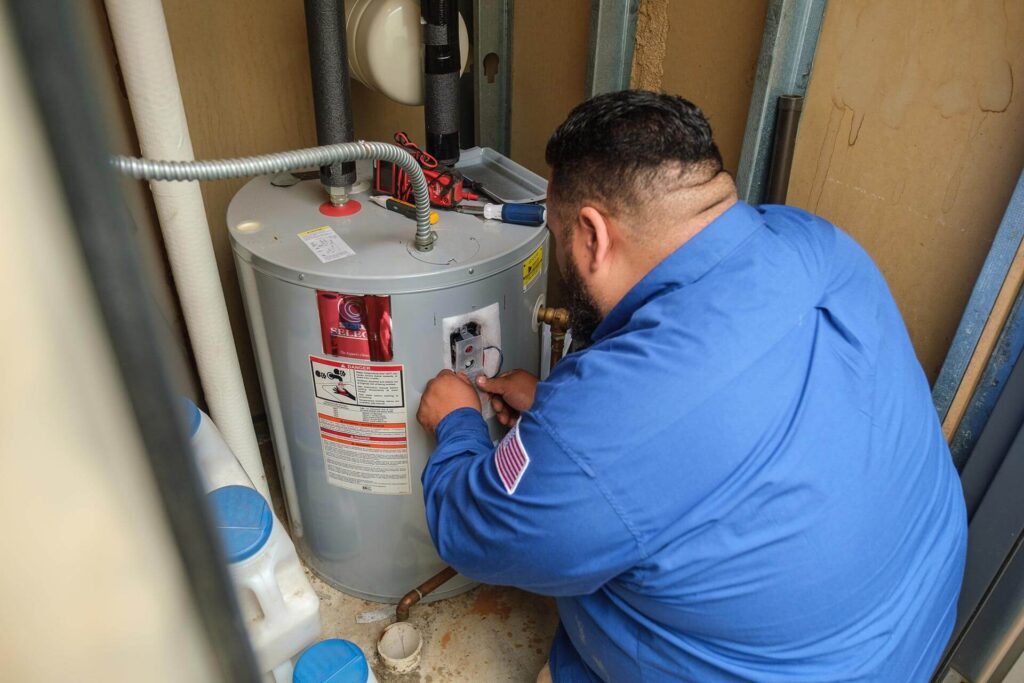 - Happy Home Services | Durham, NC A Happy Home Services technician servicing a water heater