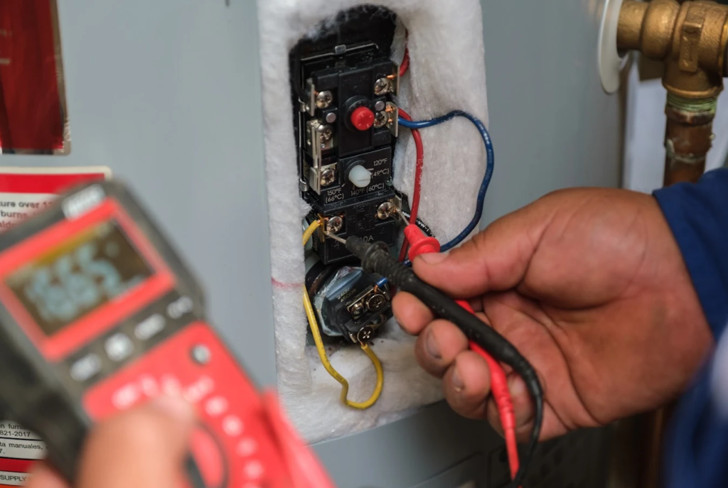 - Happy Home Services | Durham, NC Happy Homes technician diagnosing a water heater